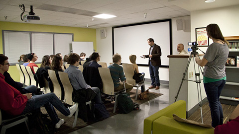 A group of students listening to a lecture. 