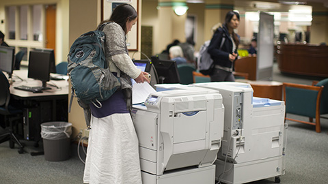 A student using a library printer.