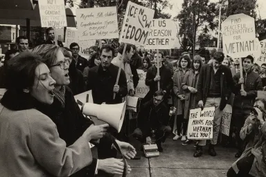 Protestors holding signs at an Anti-Vietnam War protest held in Eugene, Oregon and on the University of Oregon campus in 1966.