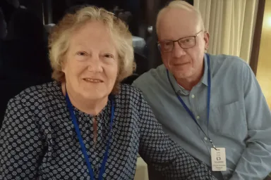 Lisa and Jon Stine wearing UO Alumni Association lanyards