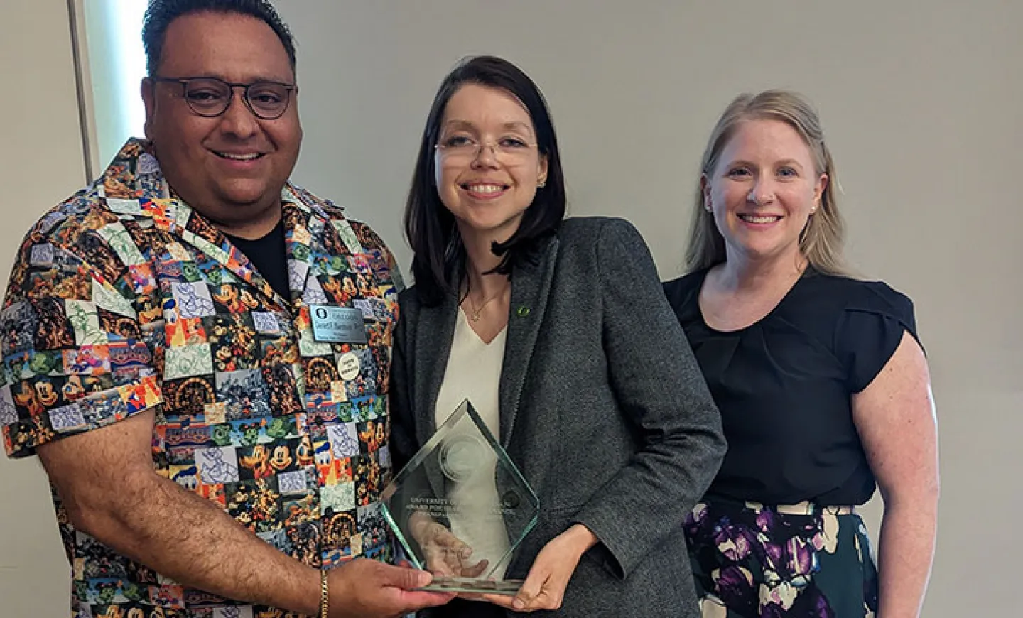 Gerard Sandoval (left), Alicia Salaz (center), and Evey Lennon (right) celebrate Salaz&#039;s recognition