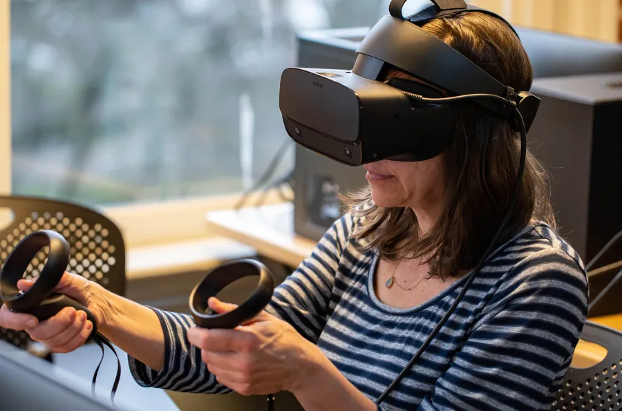 A woman wearing virtual reality goggles