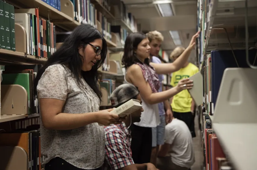 Students in library stacks